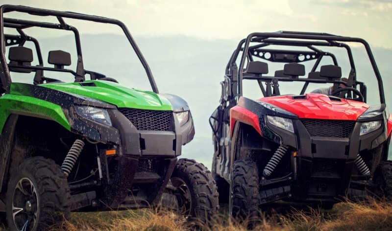 ATV manufacturer executive shaking hands with Shelby Auto Transport team